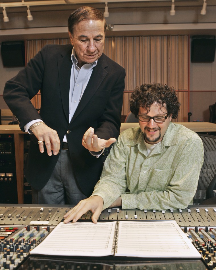 Composers Richard M. Sherman, left, and Michael Giacchino work in a sound room