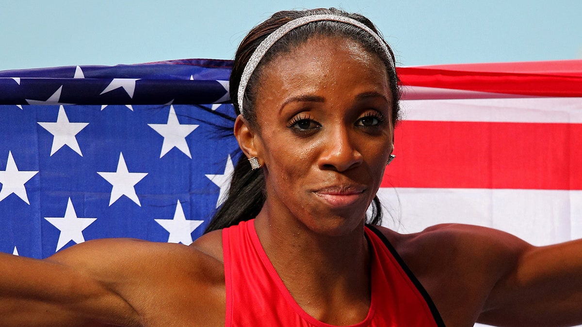 Lashinda Demus with the American flag