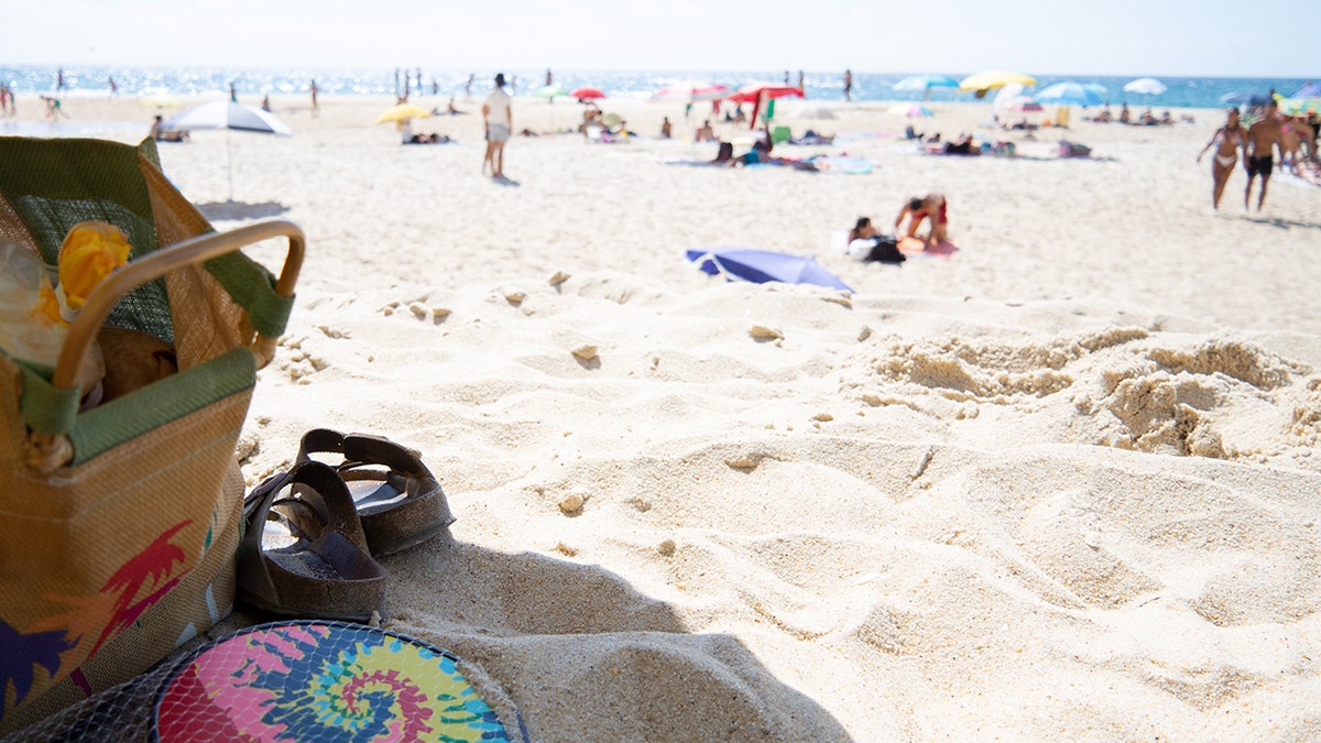A beach bag on the sand