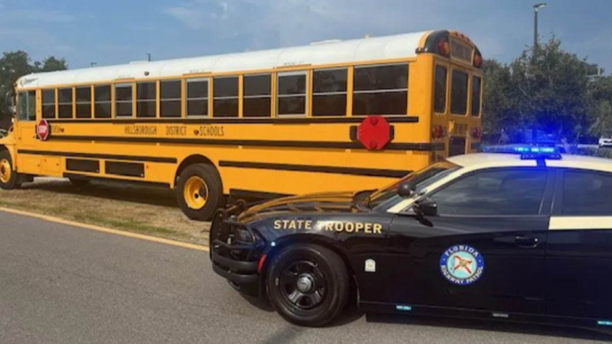 Hillsborough Co. school bus next to police car