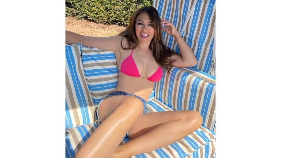 A photo of Elizabeth Hurley in a pink string bikini