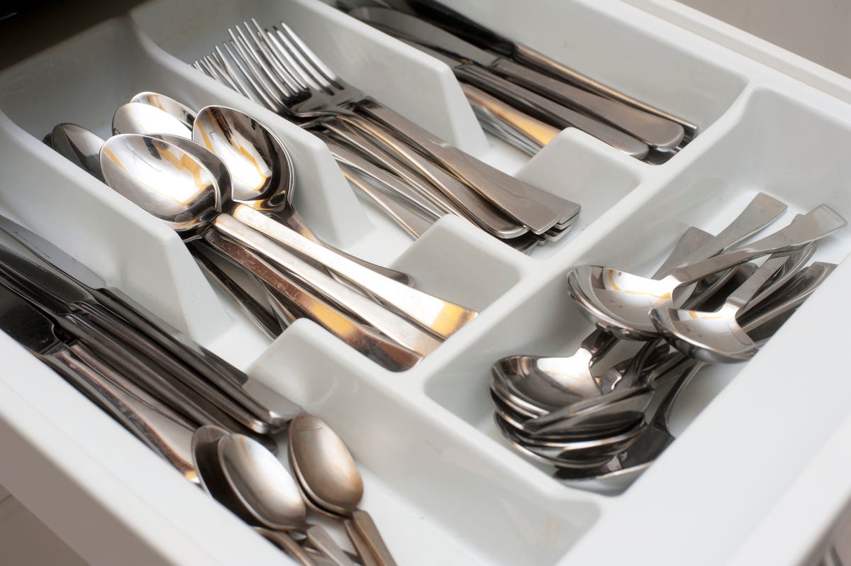 High angle view of spoons and forks in silverware tray