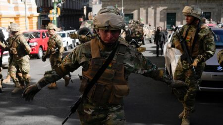 Bolivian president warns ‘irregular’ military deployment under way in capital, raising coup fears