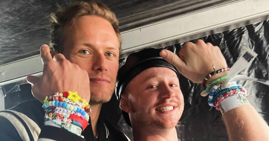 Sam Heughan Compares Taylor Swift’s ‘Evermore’ Live Set to ‘Outlander’ While Attending With Cast