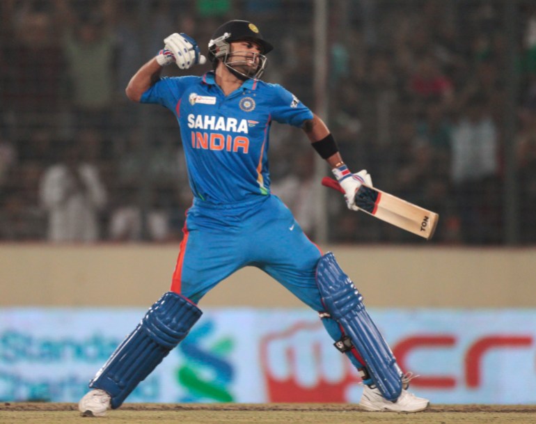 India's Virat Kohli celebrates after scoring a century against Pakistan during their Asia Cup One Day International cricket match in Dhaka March 18, 2012. REUTERS/Andrew Biraj (BANGLADESH - Tags: SPORT CRICKET)