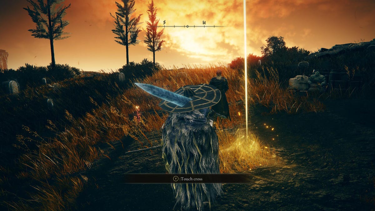 A game character standing in front of a yellow cross with a sunset in the background.