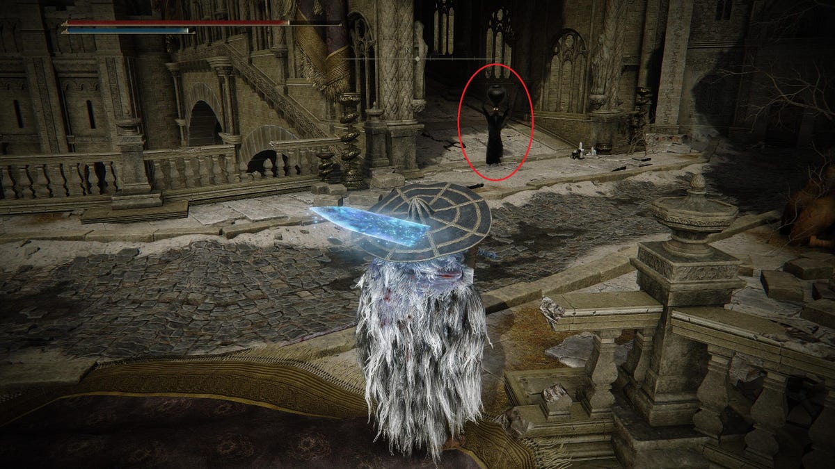 A game character looking at an enemy (outlined in red) holding a Scadutree Fragment item.