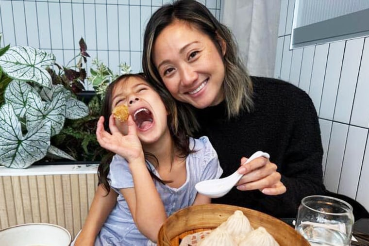 Angela Im and her daughter at a restaurant.