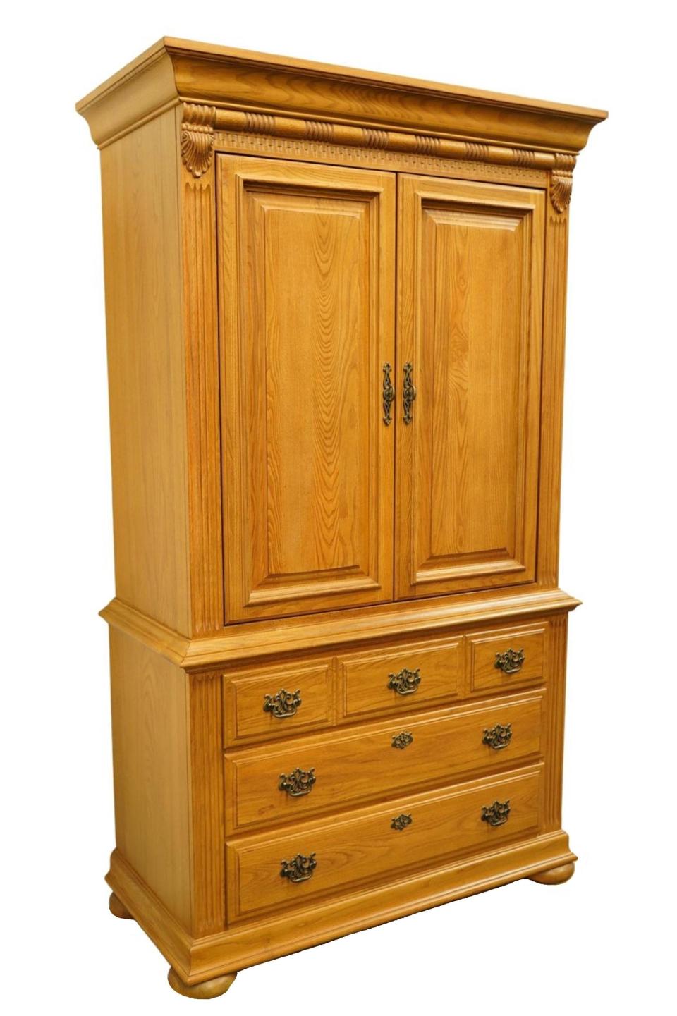 Close-up of a blonde wood closed armoire