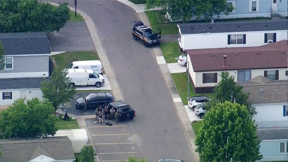 An aerial view of police surrounding a Rochester Hills, Michigan, home where they believe the suspect is contained. - WXYZ
