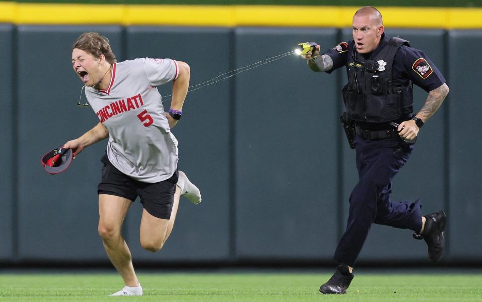 Watch: Pitch-invading baseball fan tasered by police after performing backflip