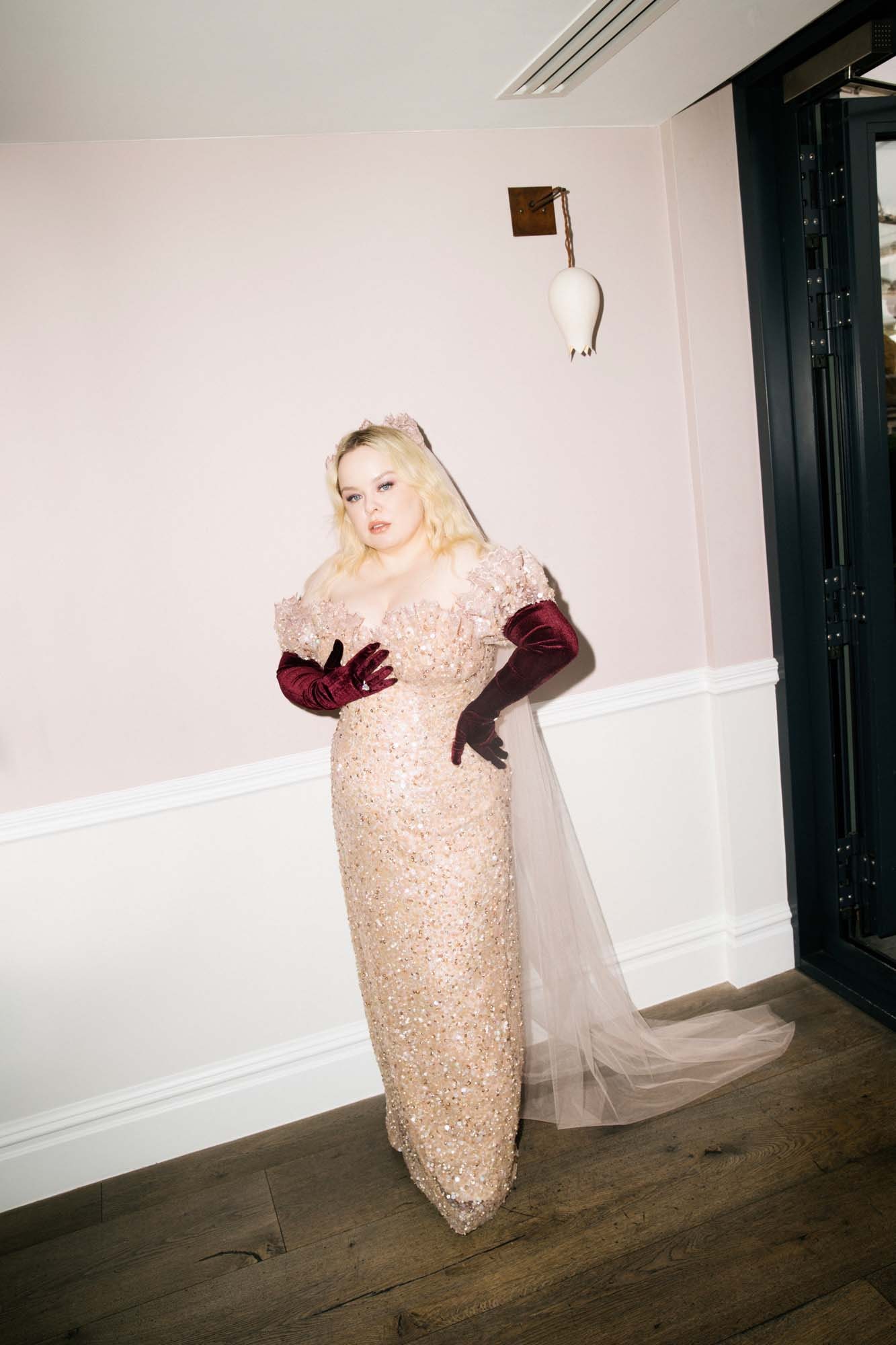 Image may contain Clothing Dress Fashion Formal Wear Gown Wedding Wedding Gown Adult Person and Glove