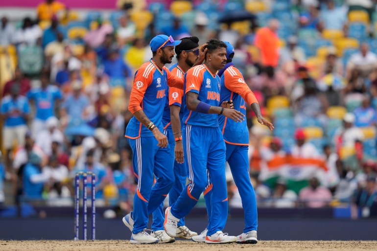 India's Hardik Pandya, second right, is congratulated by teammates after taking the wicket of South Africa's Heinrich Klaasen during the ICC Men's T20 World Cup final cricket match between India and South Africa at Kensington Oval in Bridgetown, Barbados, Saturday, June 29, 2024. (AP Photo/Ramon Espinosa)