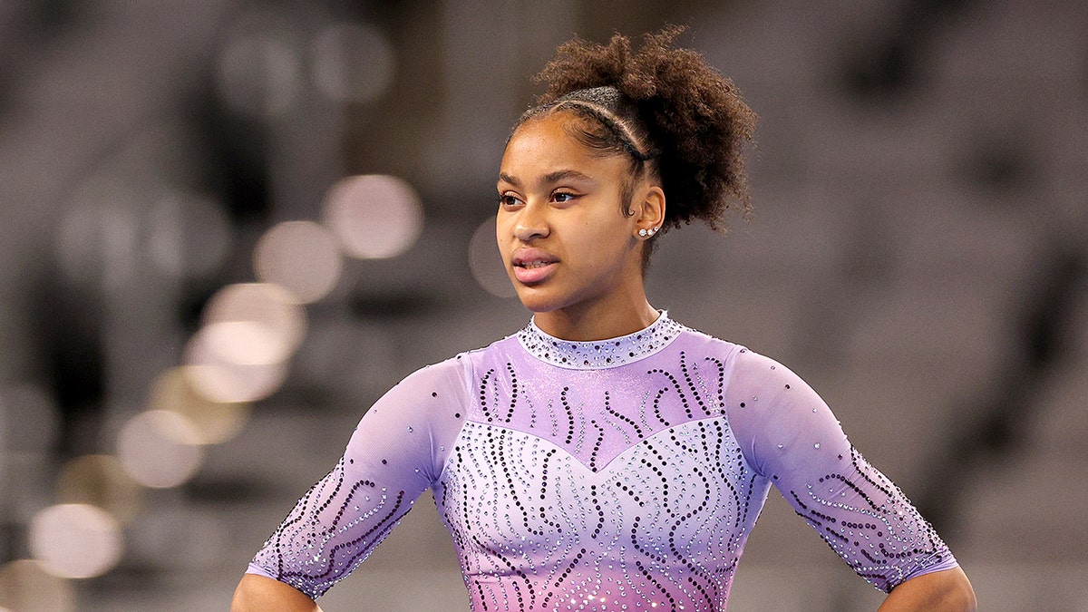 Skye Blakely looks on gym mat