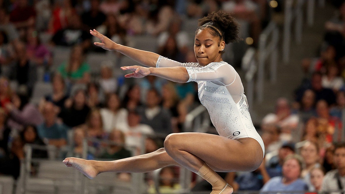 Skye Blakely balances on beam