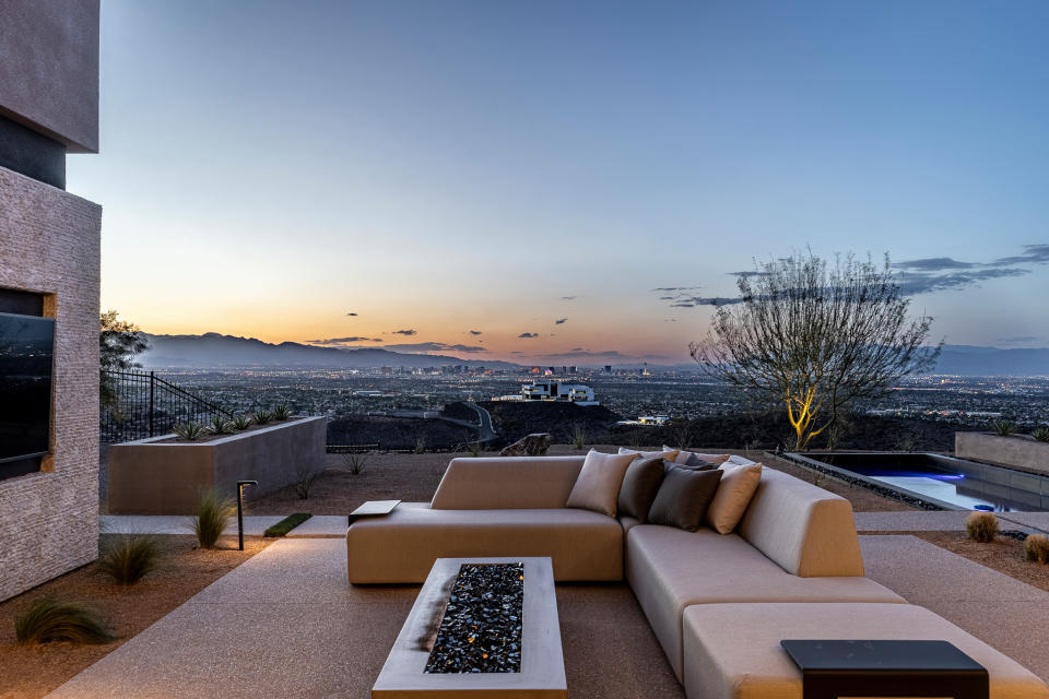 Outdoor seating with fire element at Oscar De La Hoya's house in Las Vegas.