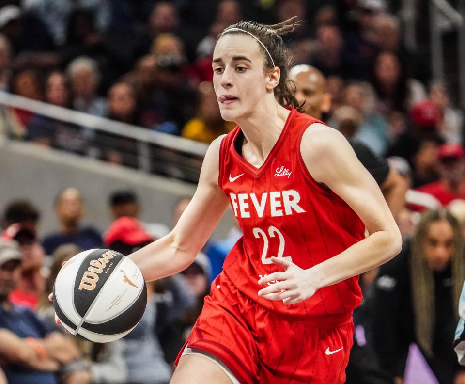 Indiana Fever guard Caitlin Clark drives toward the hoop during a game against the Chicago Sky at Grainbridge Fieldhouse.