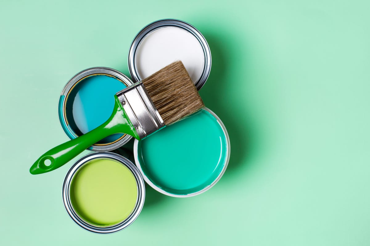 Different pots of paint including white and blue