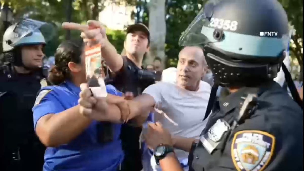 Israel supporter waves hostage poster