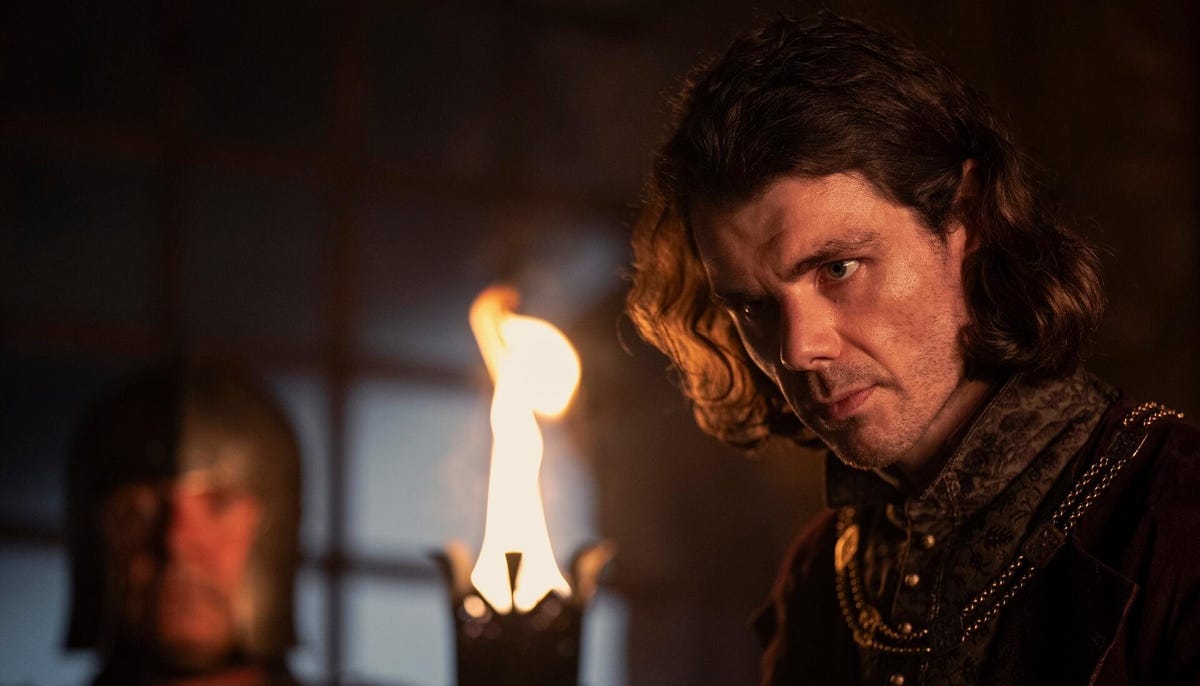 clubfoot looks toward someone with conniving look on his face in house of the dragon season 2