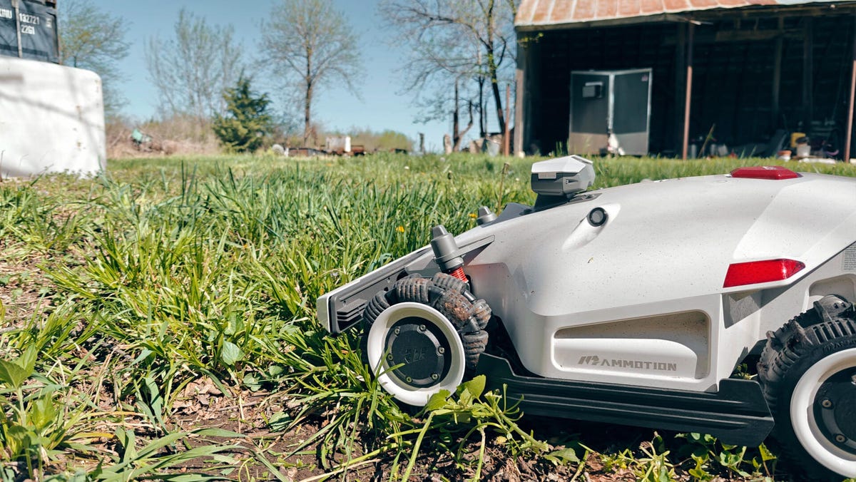closeup of a robot lawn mower on grass