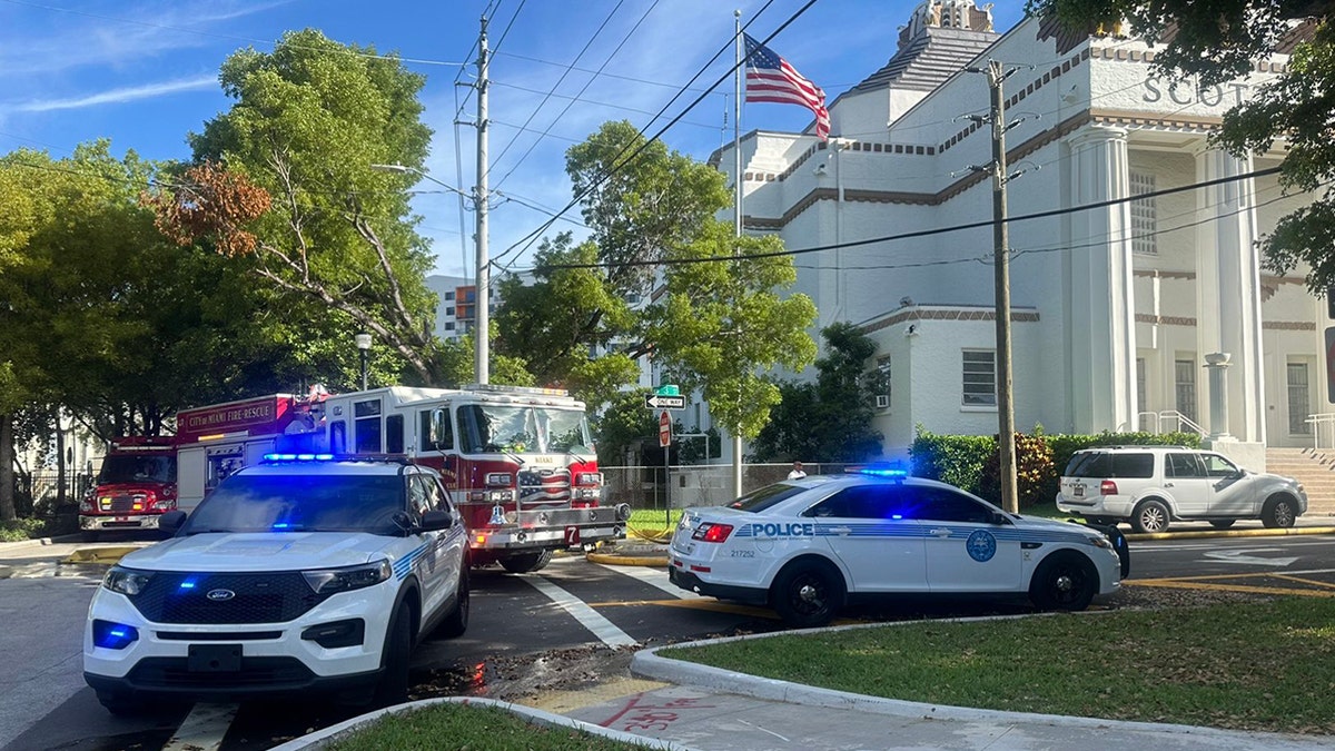 police and fire truck at scene of fire