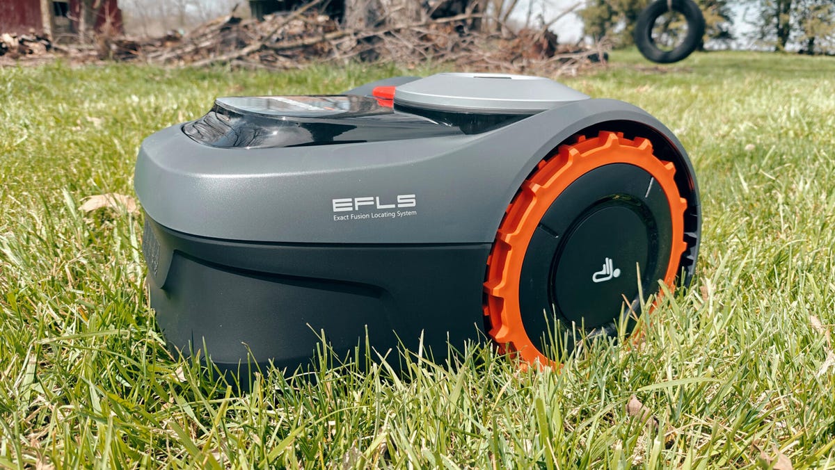 Segway Navimow 110i on grass, from the side.