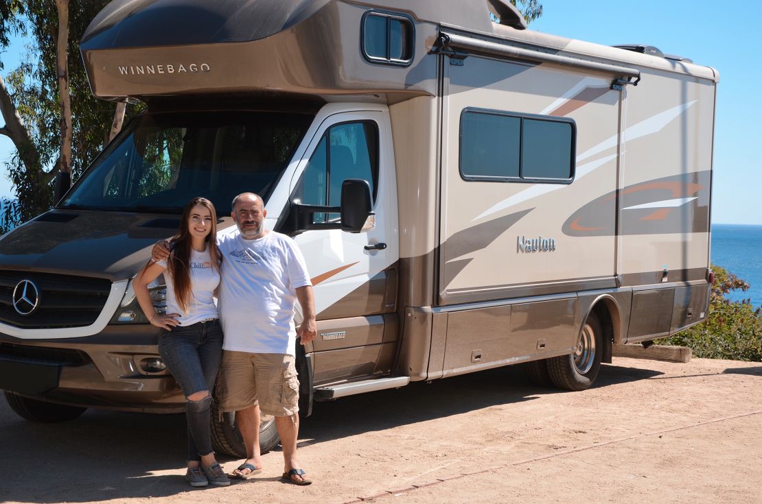 Nika Shneyder and her father and business partner, Alex Shneyder, standing by a Chill RV in Malibu RV Park, California, in 2019.
