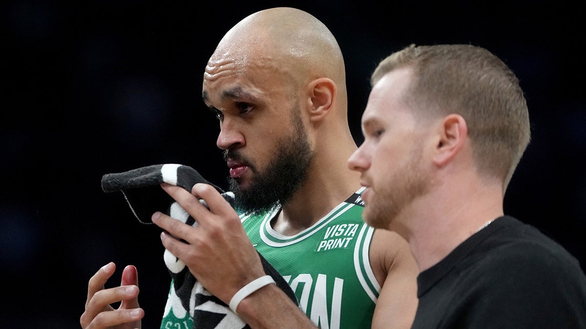 Derrick White exits the court