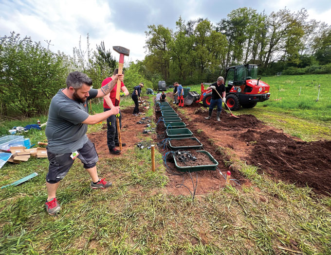 A photograph of researchers instalingl devices for measuring the weathering process