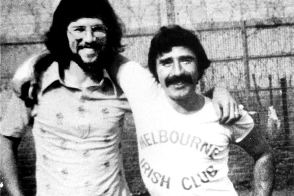 Former Sinn Fein president Gerry Adams (left) with IRA prison leader Brendan “The Dark” Hughes in Long Kesh prison near Belfast in 1973. Nice Melbourne t-shirt. 