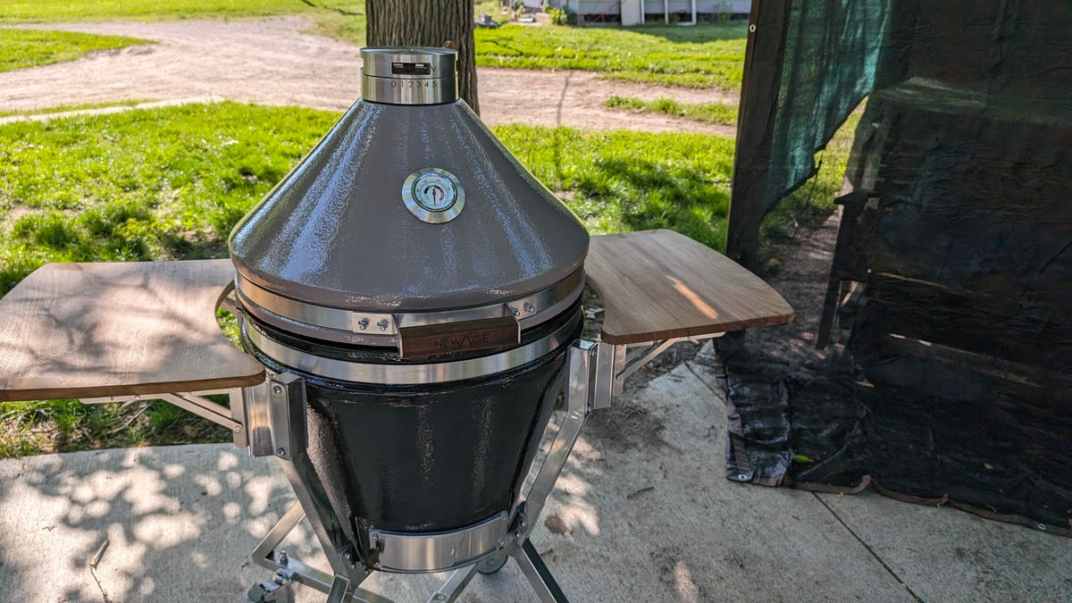 Traeger Grills Ironwood XL lid open sitting on a concrete patio