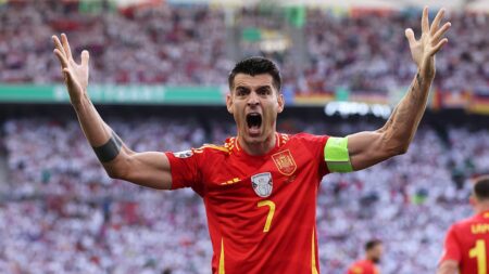 Spain star Álvaro Morata injured after security guard accidentally slips into him trying to get fan off field