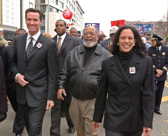 Harris is joined by San Francisco Mayor Gavin Newsom, left, and the Rev. Cecil Williams, center, for a San Francisco march celebrating Martin Luther King Jr. in January 2004. Harris was the city's district attorney from 2004 to 2011.