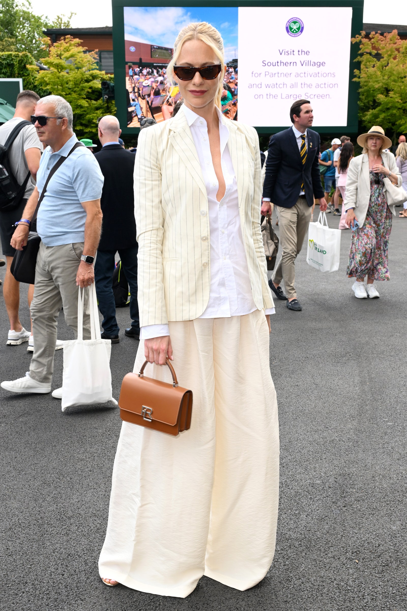 LONDON ENGLAND JULY 01 Poppy Delevingne and Charles Delevingne attend day one of the Wimbledon Tennis Championships at...