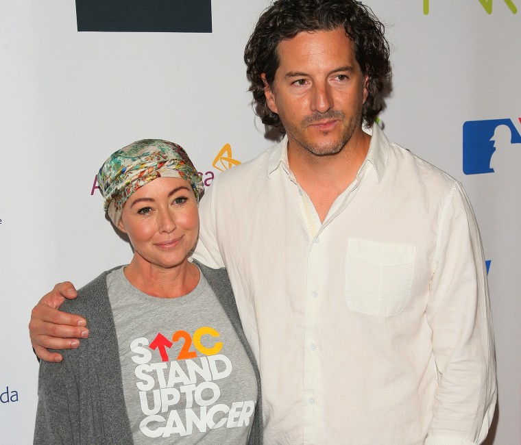 Shannen Doherty and Kurt Iswarienko attend a Stand Up To Cancer event in 2106.
