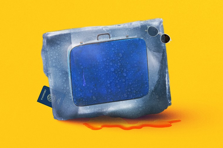 Suitcase, sunglasses and passport encased in a melting ice block.