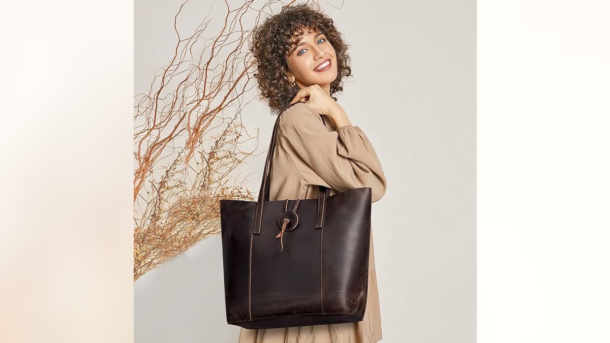 A leather bag helps you carry all your items in style.