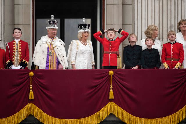 <p>Christopher Furlong/Getty</p> King Charles, Queen Camilla, Freddy Parker Bowles, Louis Lopes, Annabel Elliot, Gus Lopes, Arthur Elliot and Fiona Petty-Fitzmaurice on the balcony of Buckingham Palace following the coronation on May 6, 2023.