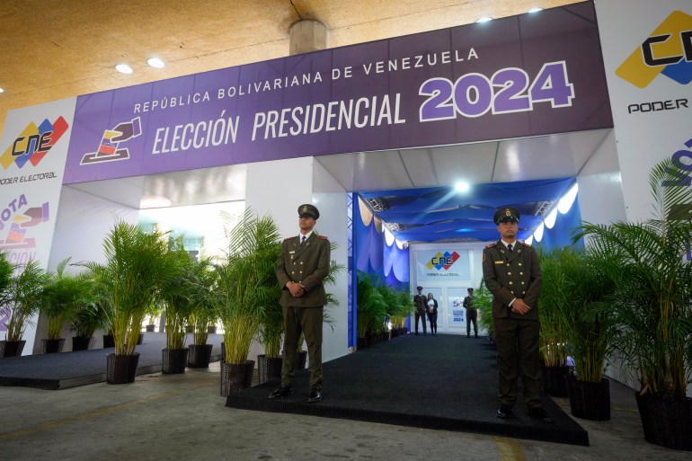 Entrance to Venezuela's election authority, guarded by two military figures.