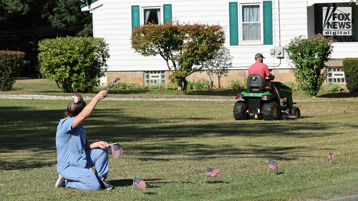 Members of the community mourn the death of Corey Comperatore on the morning of his funeral at Cabot United Methodist Church