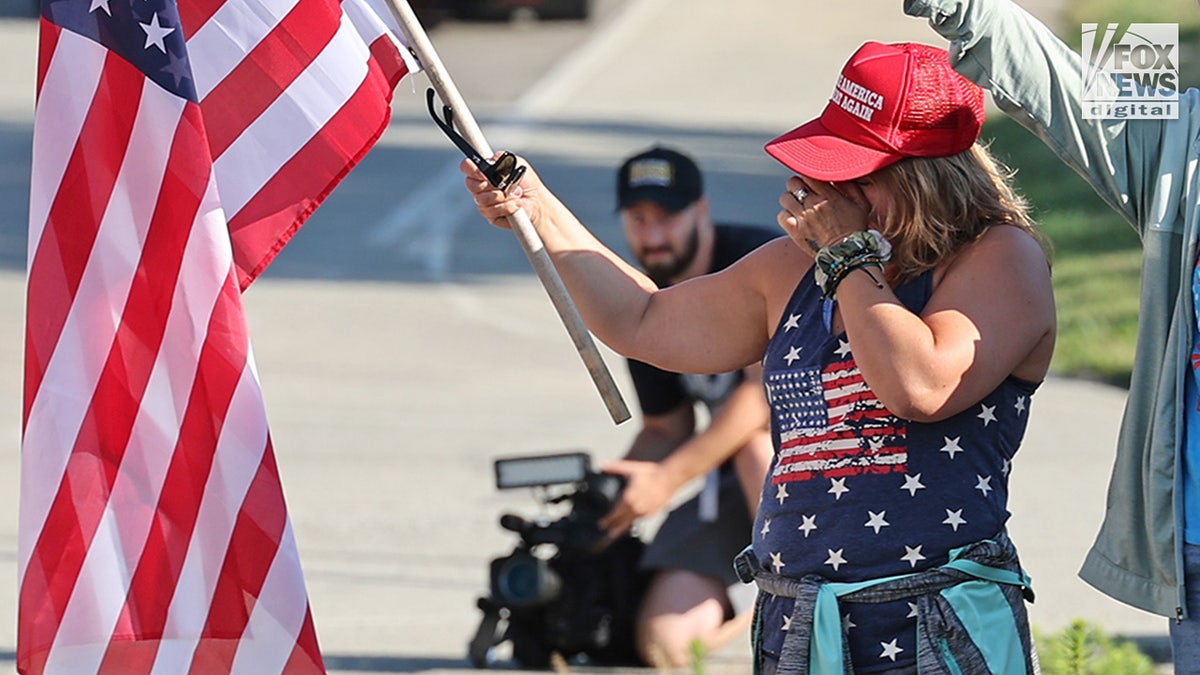 Members of the community mourn the death of Corey Comperatore on the morning of his funeral at Cabot United Methodist Church