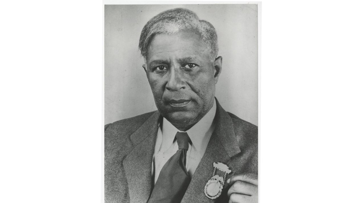 Garrett A. Morgan displaying lapel pin