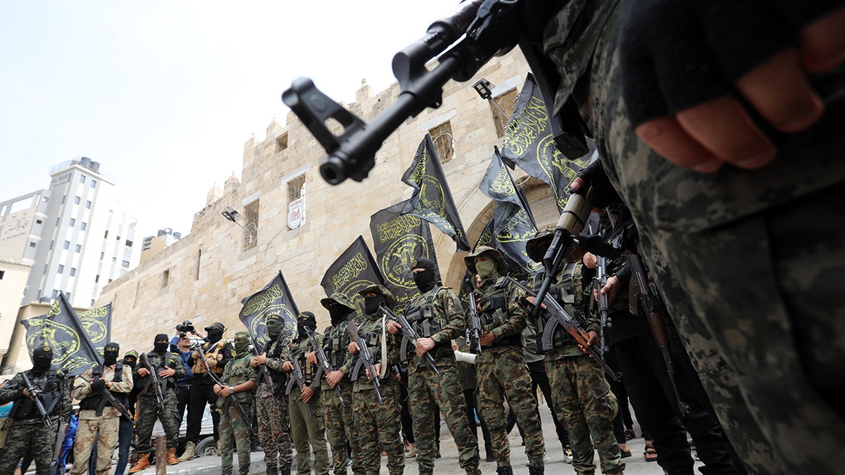 Palestinian Islamic Jihad terrorists take part in a rally to celebrate the shooting attacks in Israel, in Khan Younis, in the southern Gaza Strip April 8, 2022. (Photo by Majdi Fathi/NurPhoto via Getty Images)
