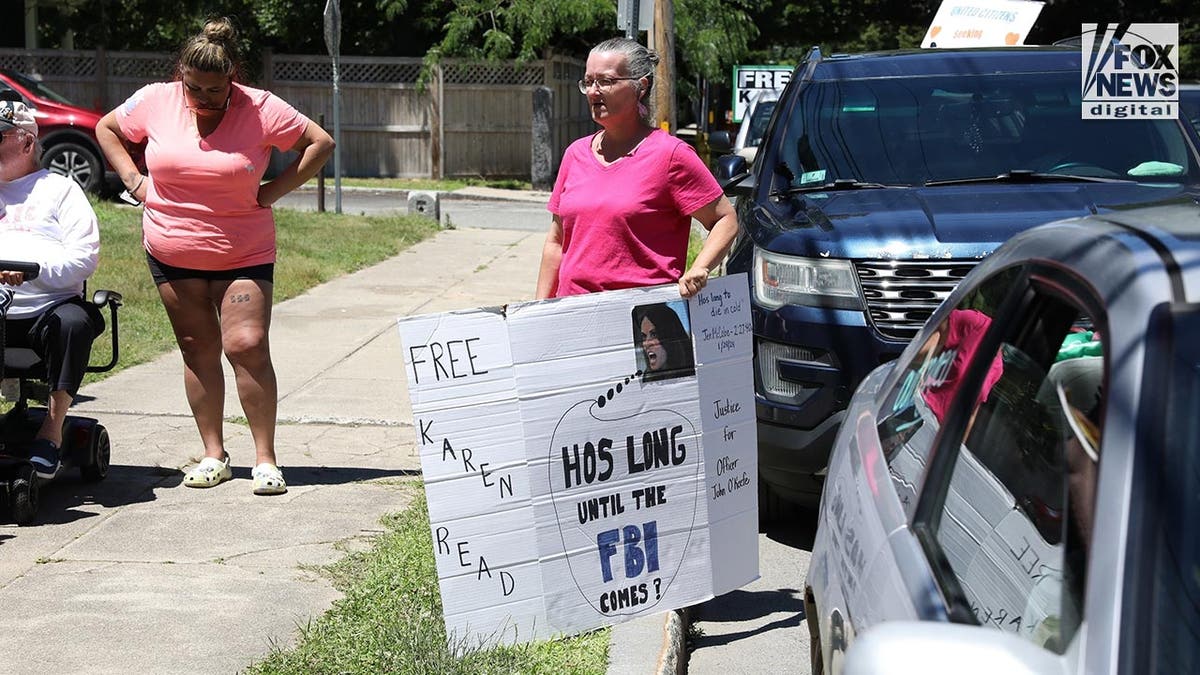 Supporters of Karen Read with signs