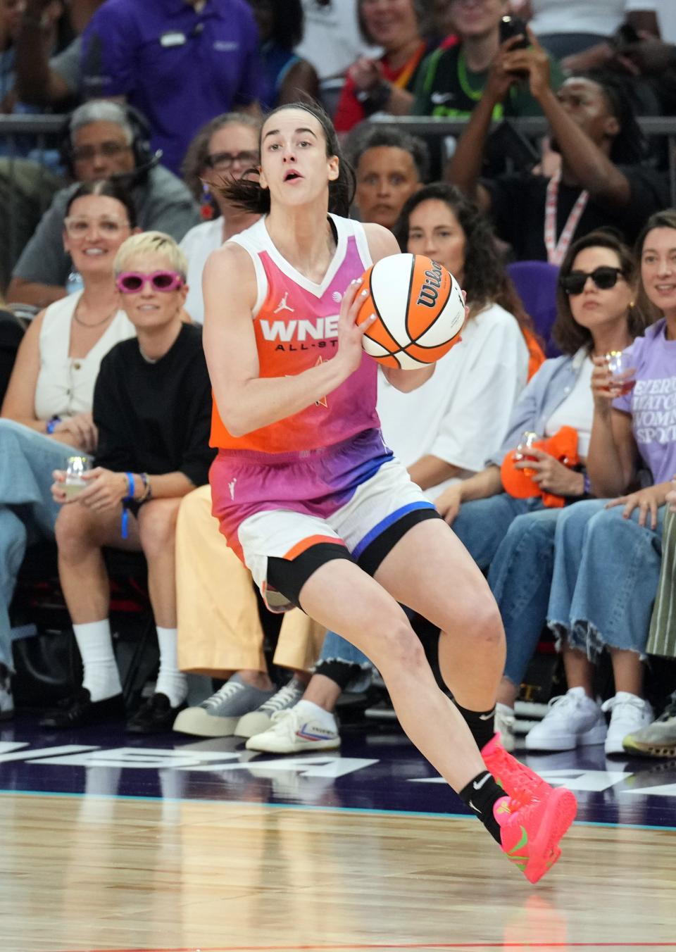 Caitlin Clark dribbles against Team USA during the WNBA All-Star Game at Footprint Center.