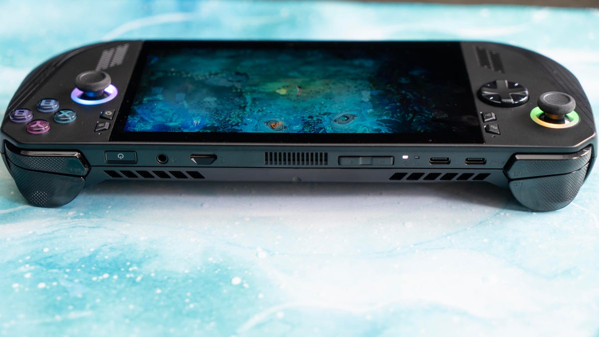 The top of the Ally X showing the triggers, bumpers and ports on a turquoise marbled background with a screen from Hades 2 on it