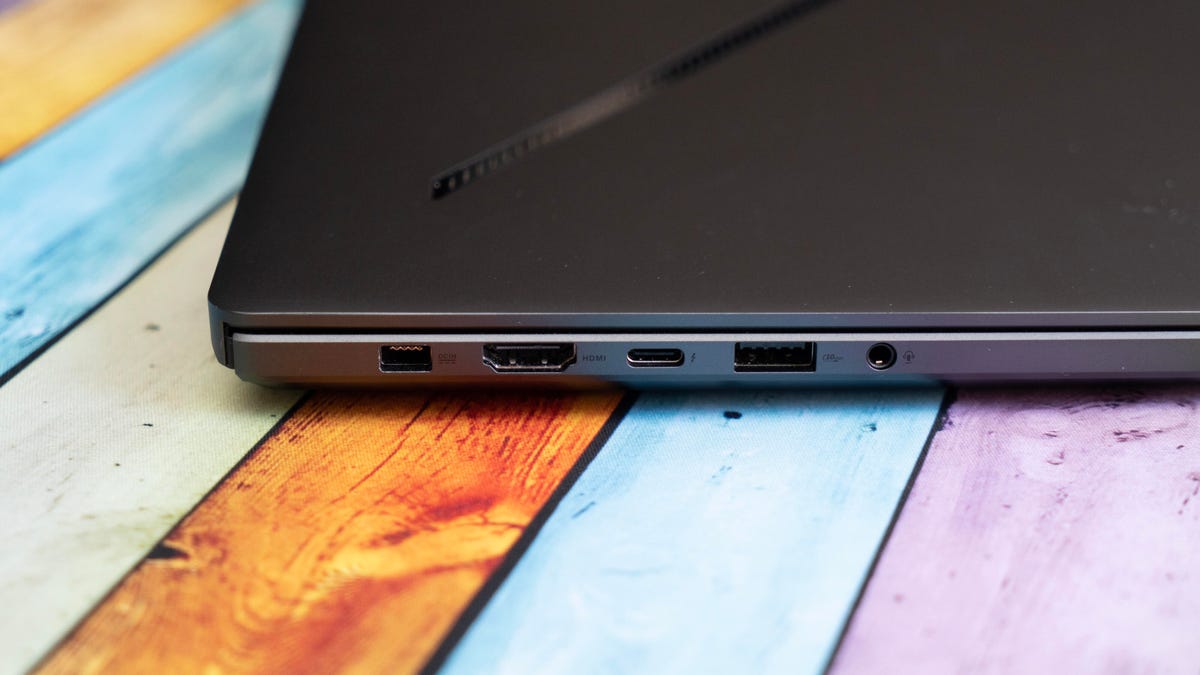 The connectors on the left side of the laptop, a rectangular power connector, HDMI, USB-C, USB-A and combo audio