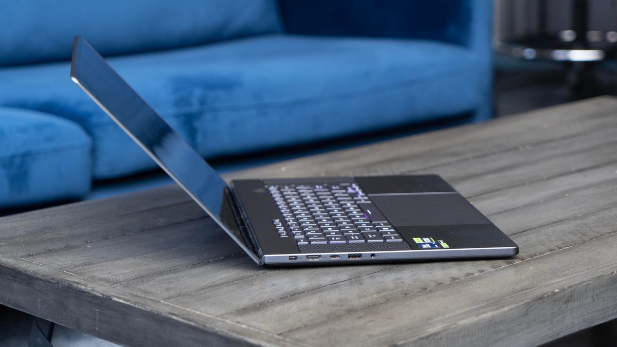 The laptop opened as far as it can go showing a side view