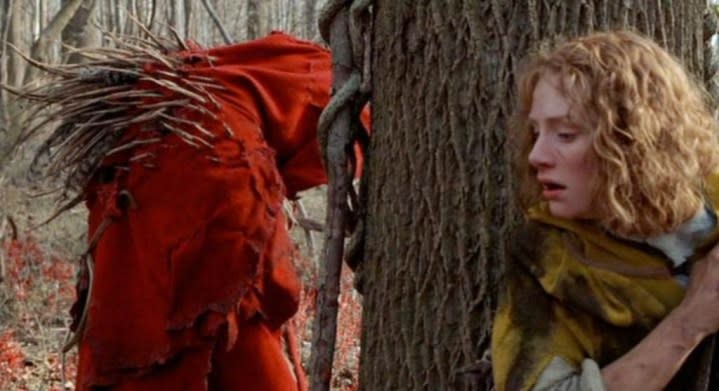 A woman hides from a monster in The Village.